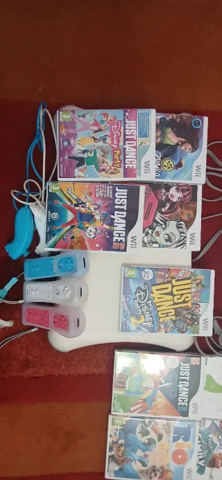 Consola Wii con juegos y tabla