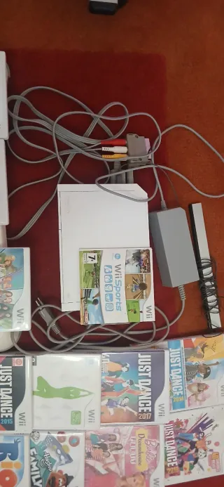 Consola Wii con juegos y tabla