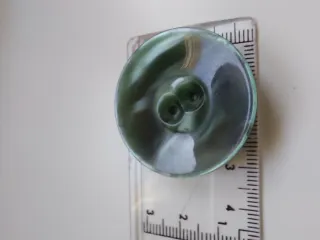 Botones verdes antiguos para abrigo