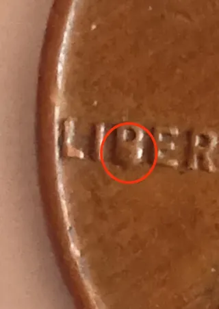 MONEDA 1 CENTAVO LINCOLN.1958D.EXCESO METAL EN B.