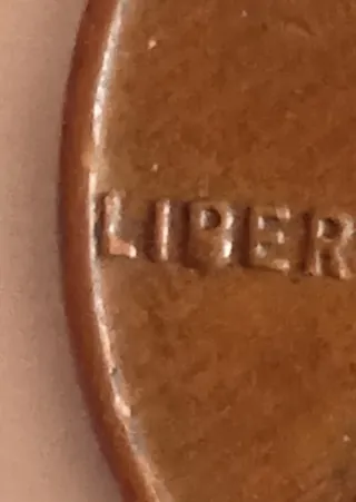 MONEDA 1 CENTAVO LINCOLN.1958D.EXCESO METAL EN B.