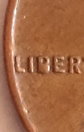 MONEDA 1 CENTAVO LINCOLN.1958D.EXCESO METAL EN B.