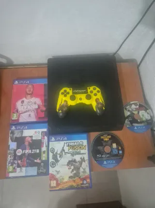 Consola PS4 con juegos y mando