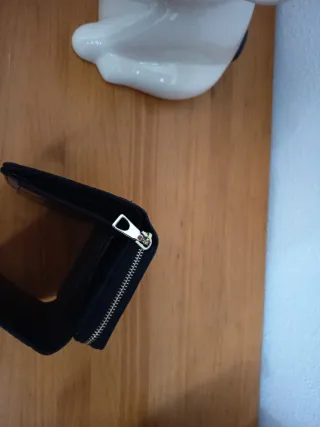 Cartera Parfois piel negra.