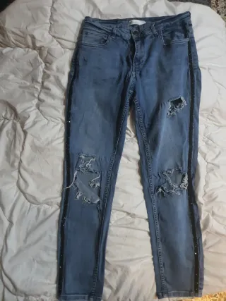 Jeans donna strappati con strass