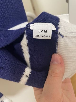 Ropa bebé niño azul con ancla.