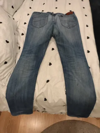 Pantalón vaquero Lee W38 Rotos