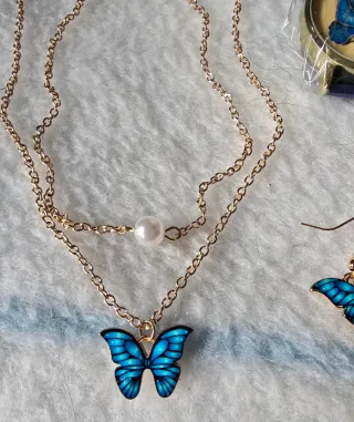 Conjunto bisutería mariposa azul y dorado