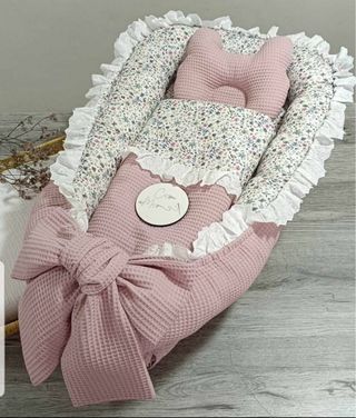 Ninho de bebé rosa com laço