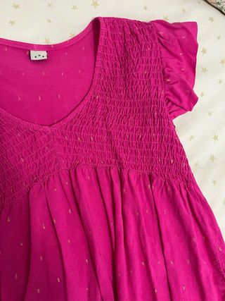 Blusa rosa con destellos dorados