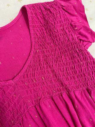 Blusa rosa con destellos dorados