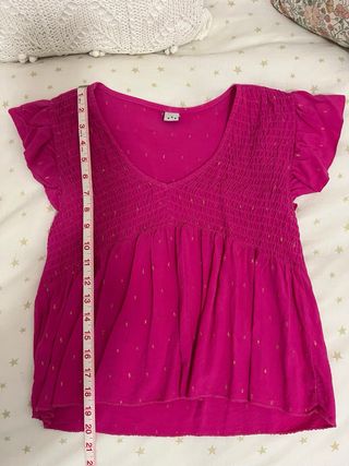 Blusa rosa con destellos dorados
