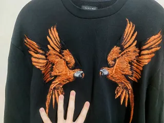 Maglione Zara con pappagalli arancioni