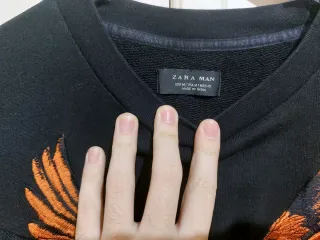 Maglione Zara con pappagalli arancioni