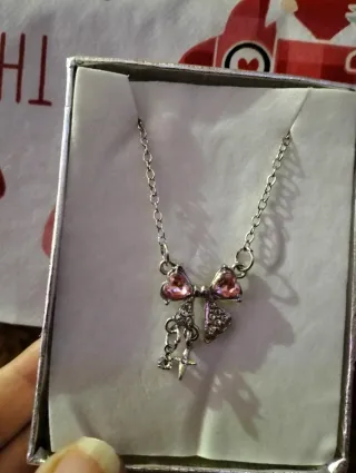 Collar lazo rosa con cruz y circonitas