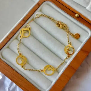 Collar y pulsera de acero dorado