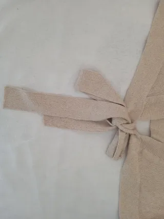 Cardigan donna oro lurex con fiocco e maniche lung