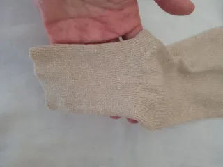 Cardigan donna oro lurex con fiocco e maniche lung