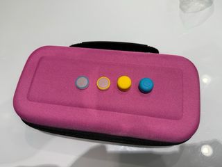 Nintendo Switch Lite Verde con Funda Rosa