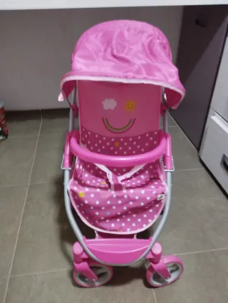Carrito de bebé de juguete rosa