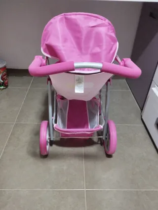 Carrito de bebé de juguete rosa