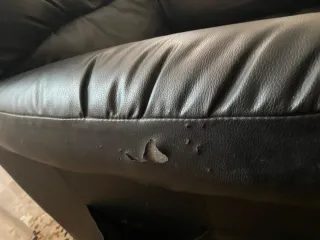 Sillón reclinable de piel negro,