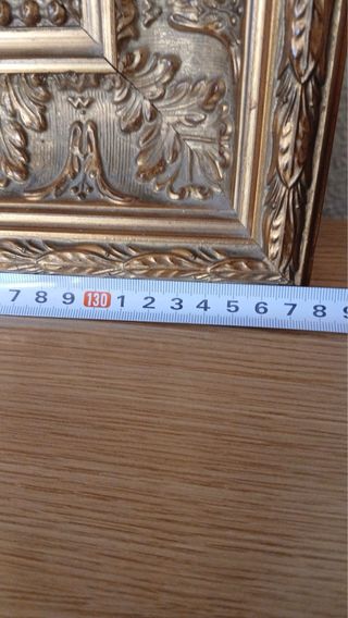 Marco de madera y metal dorado