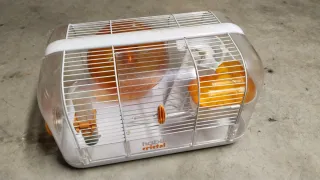 Jaula para hámster transparente y naranja