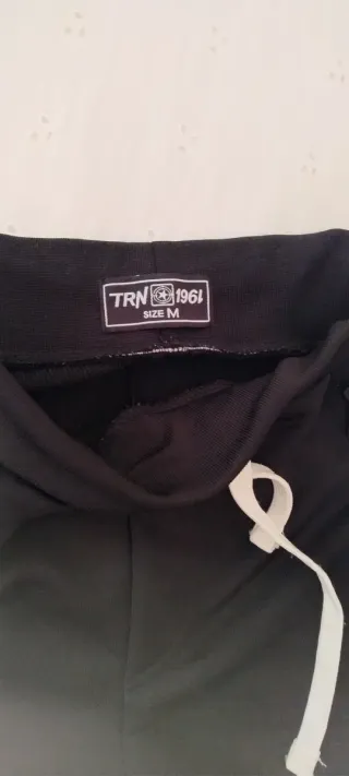 Pantaloni tuta neri con zip