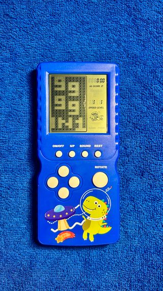 Consola Tetris Azul Dinosaurio Espacial