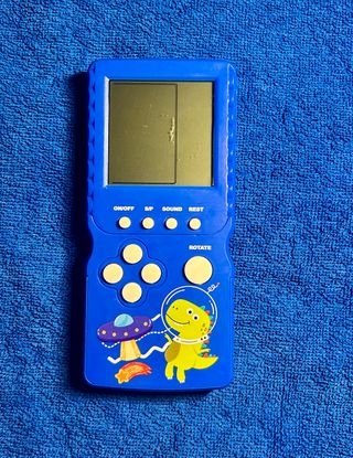 Consola Tetris Azul Dinosaurio Espacial