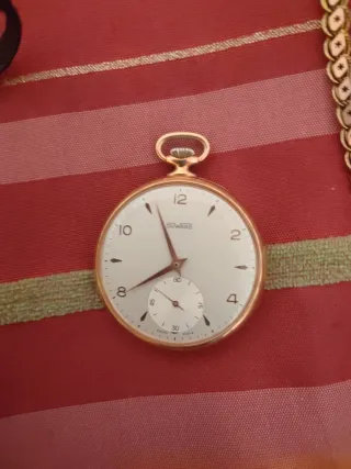 Reloj de bolsillo antiguo dorado