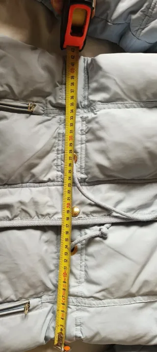 Plumas azul claro con capucha