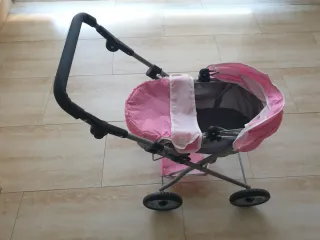 Carrito de muñecas rosa con lunares