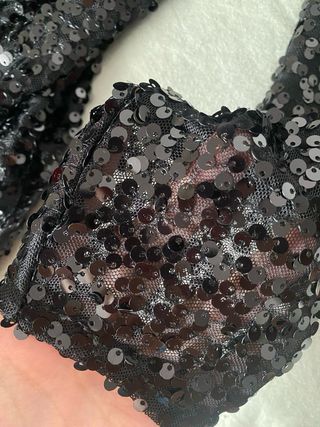 Mono negro lentejuelas fiesta fin de año