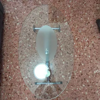Mesa de centro cristal ovalada con ruedas