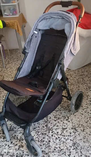 Carro de bebé con saco y plástico de lluvia