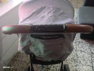 Carro de bebé con saco y plástico de lluvia