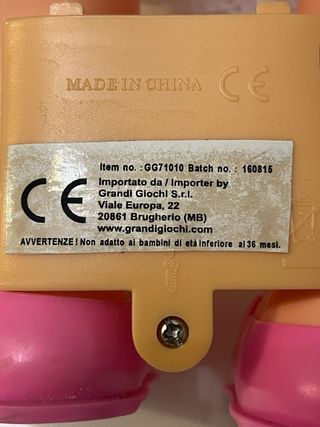 Bambola parlante vestita di rosa