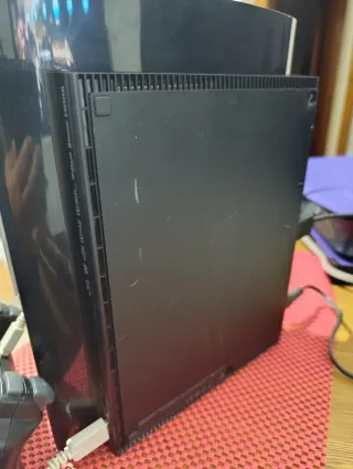 PS3 Super Slim con muchos juegos