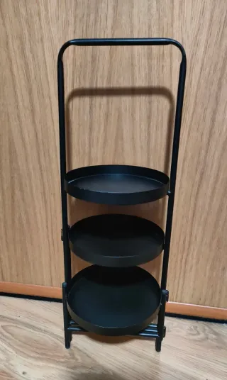 Soporte para plantas de metal negro