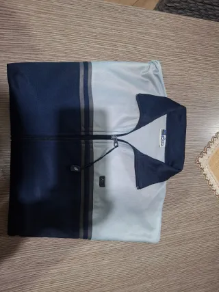 Giacca Asics blu e grigia