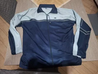 Giacca Asics blu e grigia