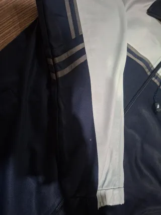 Giacca Asics blu e grigia