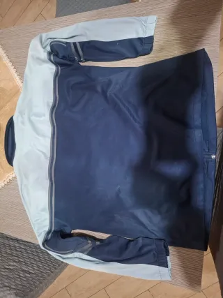 Giacca Asics blu e grigia