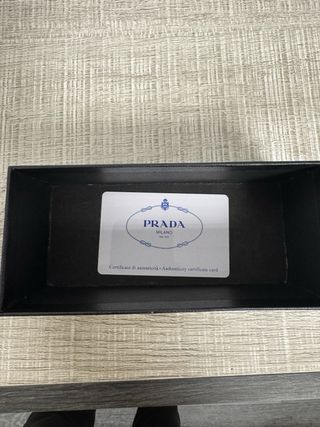 Occhiali da sole donna Prada dorati e neri