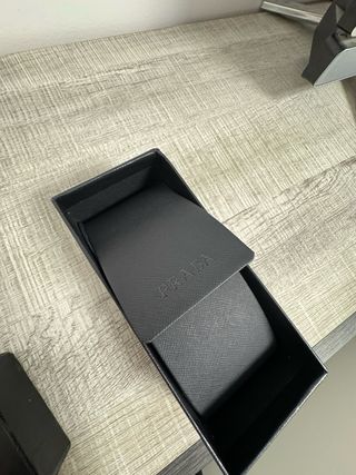 Occhiali da sole donna Prada dorati e neri