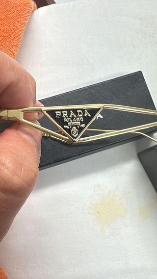 Occhiali da sole donna Prada dorati e neri