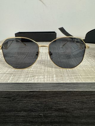 Occhiali da sole donna Prada dorati e neri