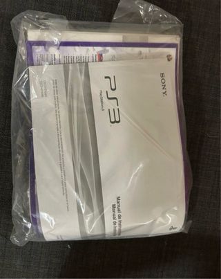 PlayStation 3 con volante y micrófonos